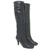 Authentic pre-owned Chanel knee-high black leather boots with CC chain trim and cap toe, size 36.5
