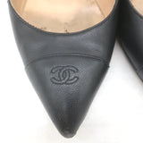 Chanel black leather CC cap-toe wedge pumps with chain trim, pre-owned luxury heels, size 35.5