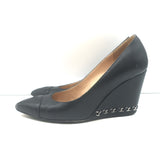 Chanel wedge pumps, black leather with CC cap-toe and chain trim, pre-owned authentic luxury