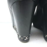 Chanel CC cap-toe chain-trimmed wedge pumps in black leather, pre-owned authentic luxury, size 35.5