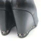 Chanel authentic wedge pumps in black leather with CC cap-toe and chain trim, pre-owned luxury heels size 35.5