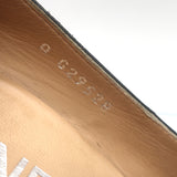 Authentic pre-owned Chanel chain-trimmed CC cap-toe wedge pumps, black leather