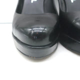 Chanel cap-toe platform pumps in black leather and patent, pre-owned with authentic designer wear