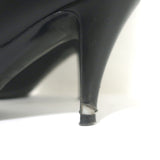 Chanel knee-high cap-toe boots in black leather with CC chain trim, authentic pre-owned, size 36.5