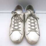 Golden Goose Superstar white leather sneakers with blue accents, authentic pre-owned with gentle wear