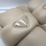 Prada triangle-logo padded flat mules in nude leather, authentic pre-owned luxury