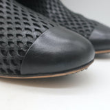 Chanel perforated cap-toe leather flat ankle boots in black, authentic pre-owned luxury, size 38