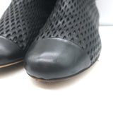 Authentic Chanel cap-toe perforated leather flat ankle boots in black, gently pre-owned, size 38