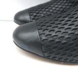 Authentic Chanel perforated cap-toe leather flat ankle boots in black, pre-owned, gently worn, size 38