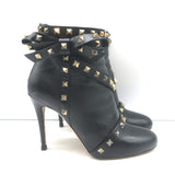 Valentino Rockstud bow ankle boots in black leather, pre-owned with signs of wear, authentic designer piece