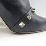 Authentic Valentino Rockstud bow ankle boots in black leather, pre-owned with scuffs and tarnished studs