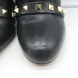 Authentic Valentino Rockstud bow ankle boots in black leather, pre-owned.