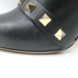 Authentic Valentino Rockstud bow ankle boots in black leather, pre-owned with tasteful wear.
