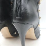 Valentino Rockstud bow ankle boots in black leather, authentic pre-owned with visible wear