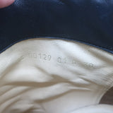 Authentic Valentino Rockstud bow ankle boots in black leather, pre-owned with visible wear and tarnished studs