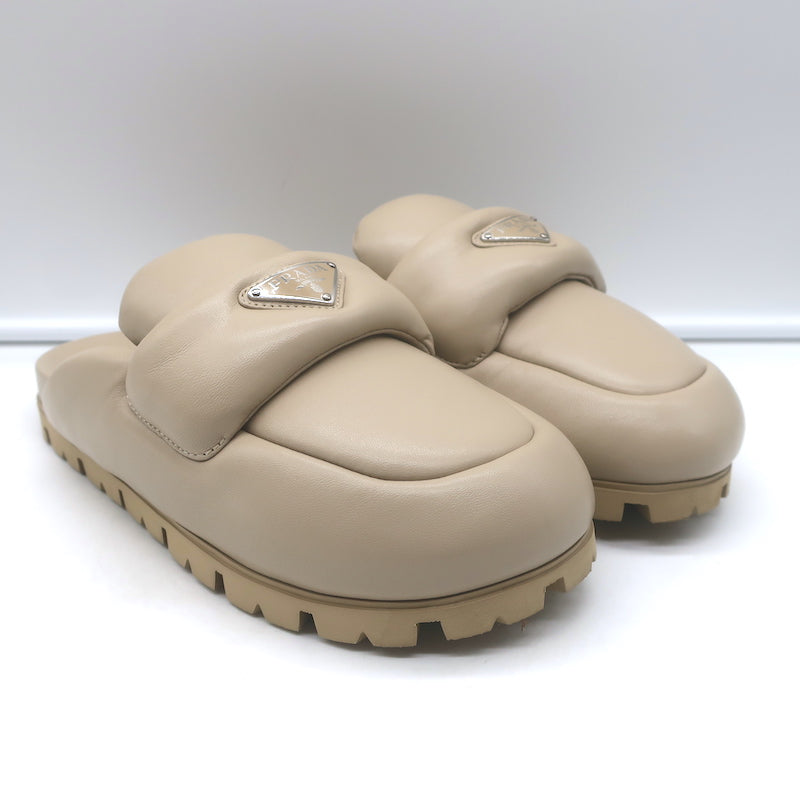 Prada triangle-logo padded flat mules in nude leather - pre-owned, authentic luxury