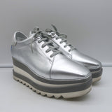 Stella McCartney Sneak Elyse platform sneakers in silver faux leather, authentic pre-owned designer pair