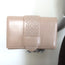 Alaia Simone Arabesque Studded Leather Clutch Sable