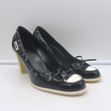 Chanel 06P bow cap-toe pumps in black and white patent leather, pre-owned authentic luxury (Size 39)