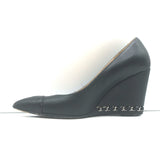 Chanel CC cap-toe chain-trimmed black leather wedge pumps, authentic pre-owned