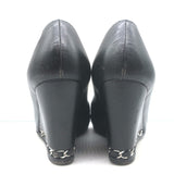 Chanel black leather wedge pumps with CC cap-toe and chain trim, pre-owned luxury heels size 35.5
