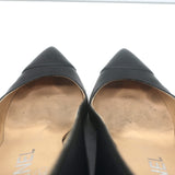 Chanel pre-owned black leather CC cap-toe wedge pumps with chain trim, elegant vintage wear (size 35.5)
