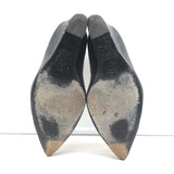 Authentic Chanel CC cap-toe chain-trimmed wedge pumps, black leather, pre-owned with visible wear