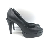 Authentic Chanel cap-toe platform pumps in black leather and patent, pre-owned with light scuffs, size 35.5
