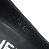 Chanel cap-toe platform pumps in black leather and patent, size 35.5 — pre-owned, authentic luxury with gentle wear.