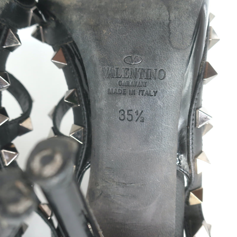 Valentino Noir Rockstud T-strap pointed-toe pumps in black patent leather, pre-owned and authentic luxury.