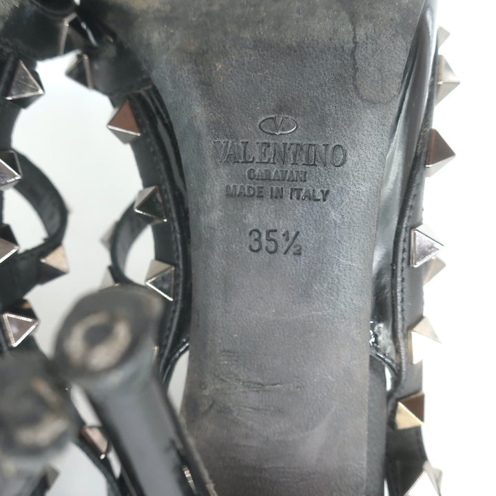 Valentino Noir Rockstud T-strap pointed-toe pumps in black patent leather, pre-owned and authentic luxury.