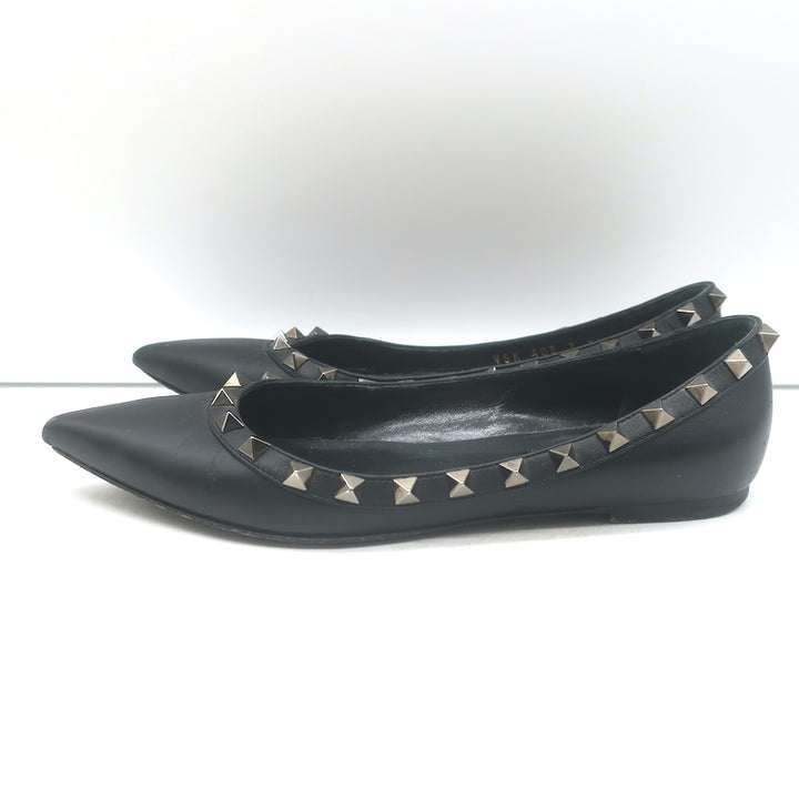 Valentino Rockstud pointed-toe ballet flats in black leather, pre-owned with minor wear and authentic hardware patina
