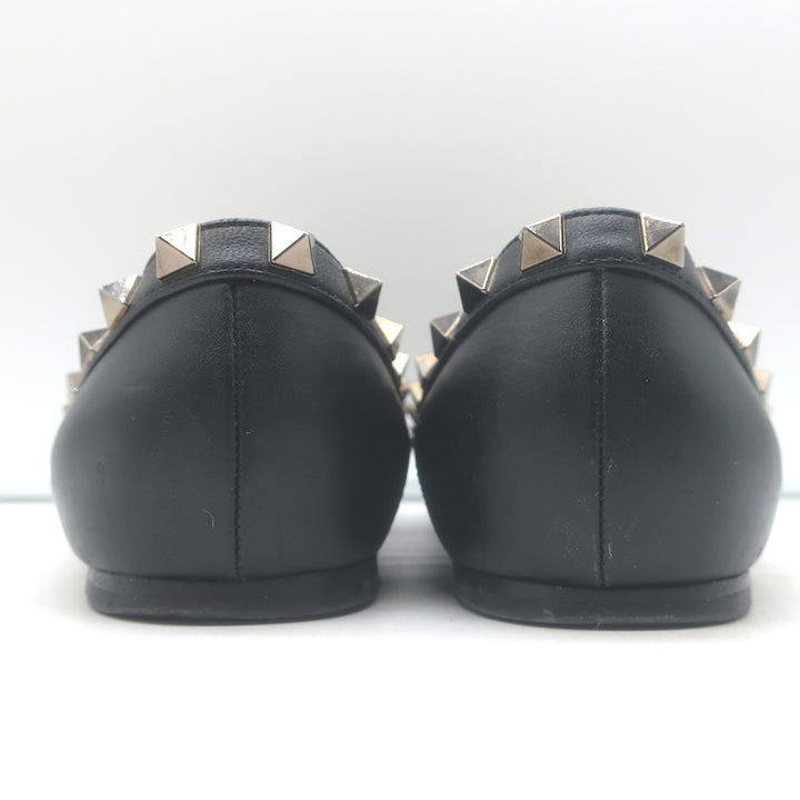Valentino Noir Rockstud pointed-toe ballet flats in black leather, pre-owned with authentic designer detailing.
