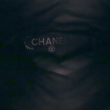 Chanel knee-high cap-toe boots in black leather with CC chain trim, pre-owned authentic luxury