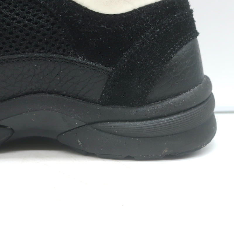 Chanel 10B CC low-top sneakers, black mesh and leather, size 36 — pre-owned authentic luxury with light wear.