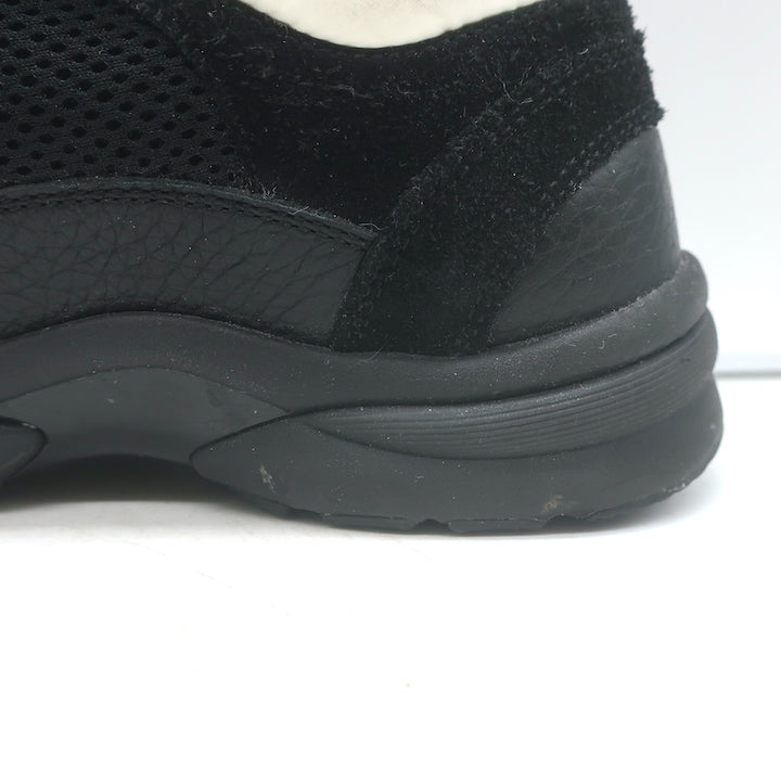 Chanel 10B CC low-top sneakers, black mesh and leather, size 36 — pre-owned authentic luxury with light wear.