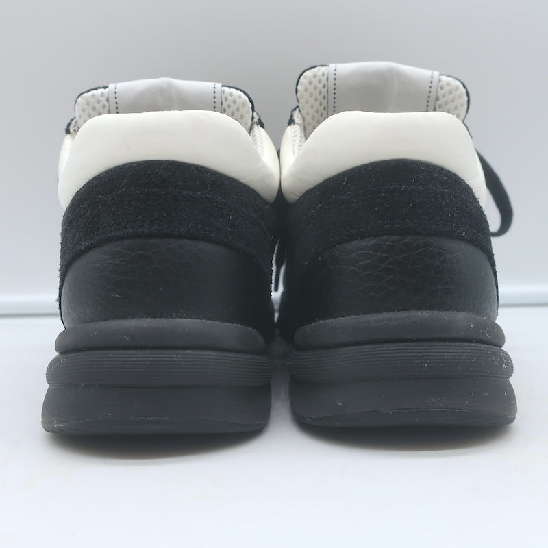 Authentic pre-owned Chanel 10B CC low-top sneakers in black mesh and leather, size 36