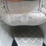 Chanel 10B CC low-top sneakers in black mesh and leather, pre-owned with minor wear, authentic designer condition