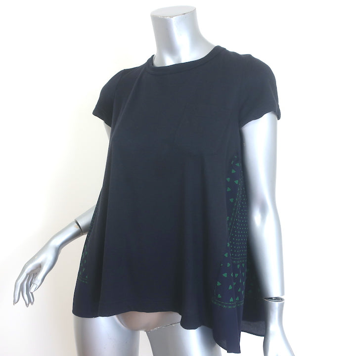Sacai Luck cap-sleeve tee in black linen-blend with heart print — pre-owned, gently worn.