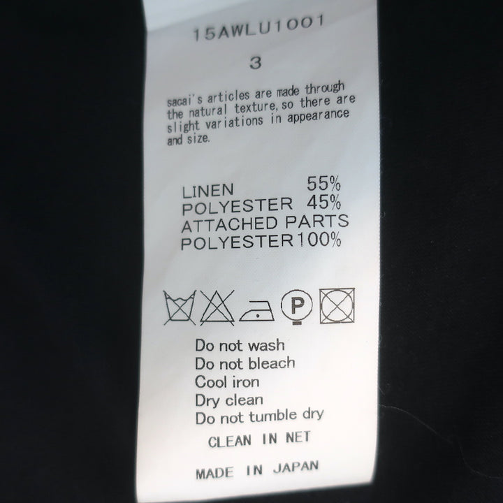 Sacai Luck tiered-back cap-sleeve tee in black linen-blend with subtle heart print, authentic pre-owned, gently worn