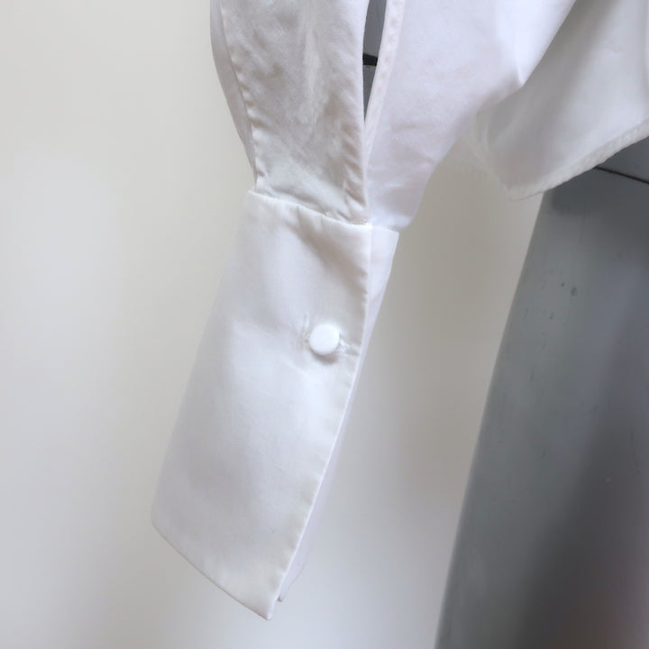 Khaite Brianne puff-sleeve button-down shirt in white poplin, authentic pre-owned and gently worn luxury piece