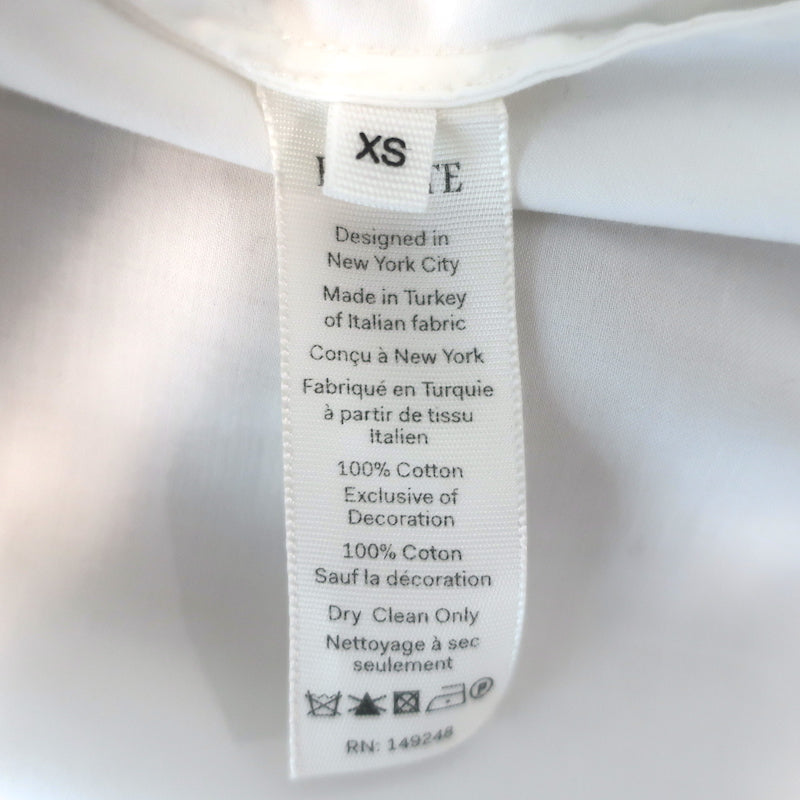 Khaite Brianne puff-sleeve button-down shirt in white poplin, size XS, pre-owned and gently worn, authentic luxury.