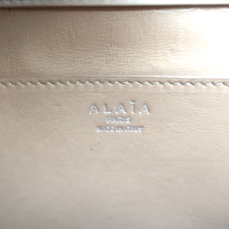 Alaia Simone Arabesque Studded Leather Clutch Sable