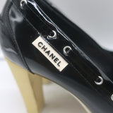 Chanel 06P bow cap-toe pumps in black and white patent leather, authentic pre-owned size 39