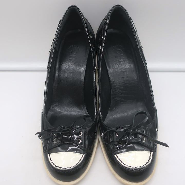 Chanel 06P bow cap-toe pumps in black and white patent leather, authentic pre-owned, size 39