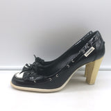 Chanel bow cap-toe pumps in black-and-white patent leather, pre-owned and authentic luxury