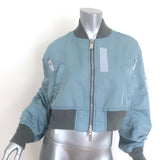 Sacai cropped MA-1 padded bomber jacket in light blue nylon, authentic pre-owned designer piece