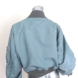 Sacai cropped MA-1 padded bomber jacket in light blue nylon, authentic pre-owned couture piece