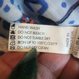 Poupette St Barth Mila tassel-embellished mini dress in white and blue woven fabric — pre-owned, authentic resort-luxe