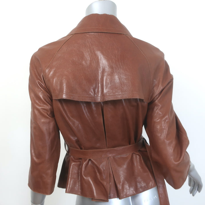 Authentic Burberry London belted brown leather short trench jacket, size US 4, gently pre-owned.